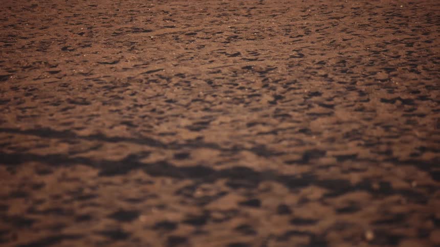 Shadow reflected on the sand