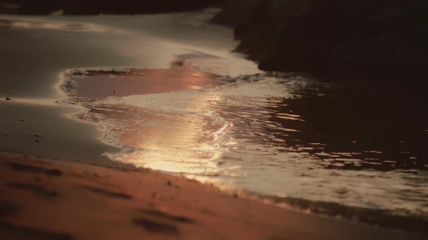 Water washing ashore from a river