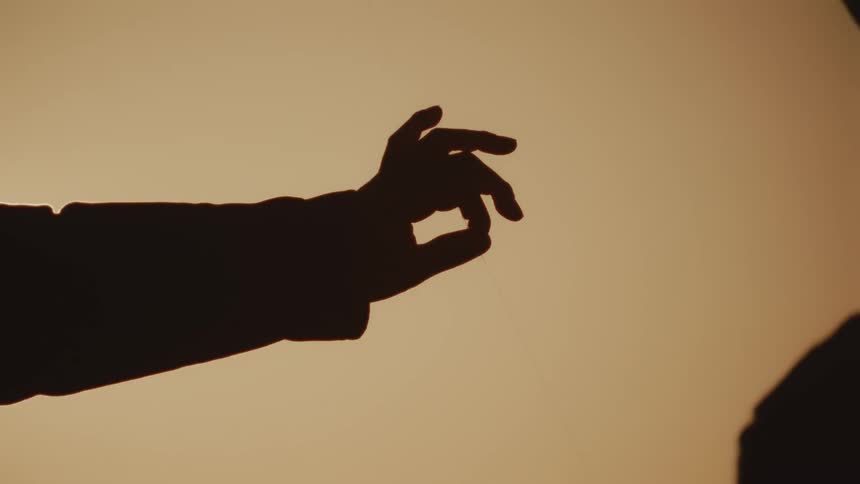 A person is covered in shade at sunrise