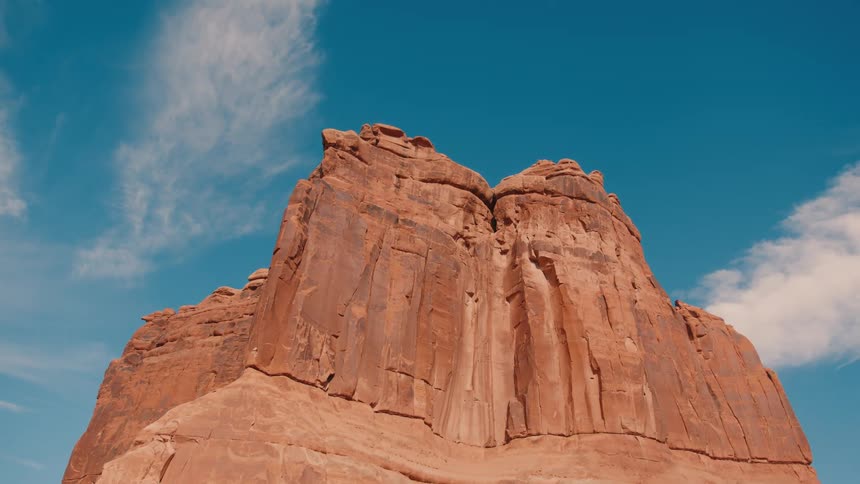 The rock formation is tall and jagged