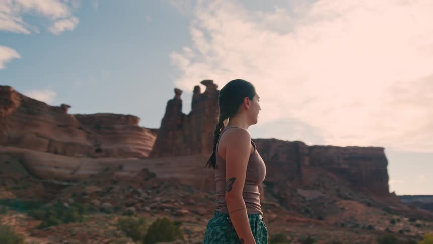 A woman looks around the canyon