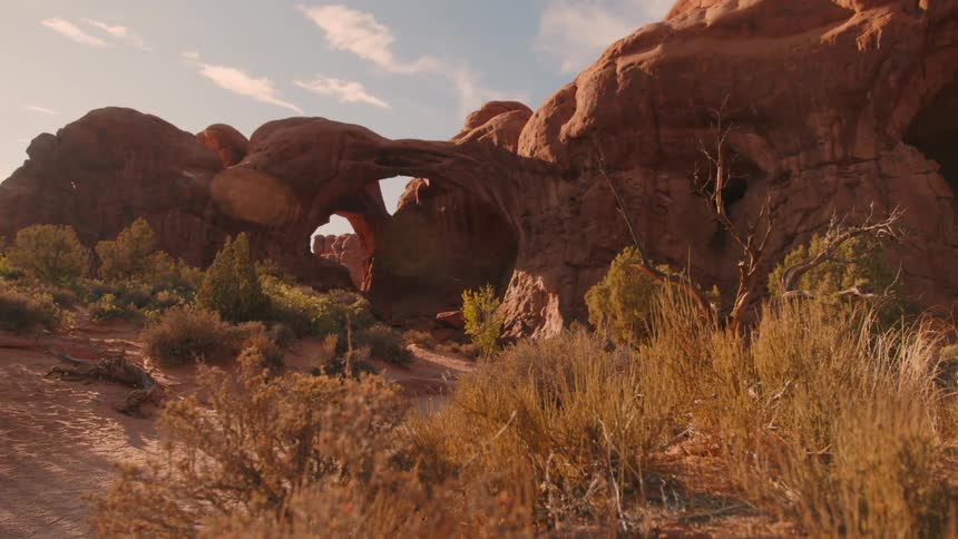 A natural arch is in the canyon