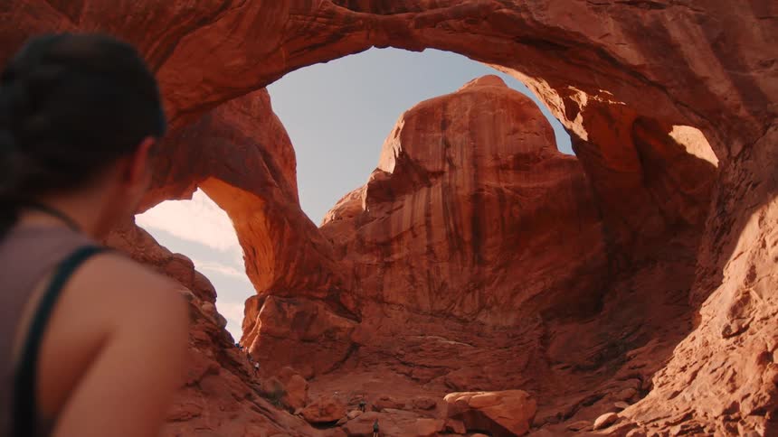 The woman hikes in the canyon