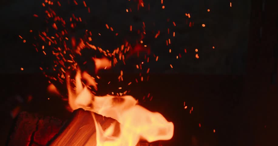 The logs are burning at night