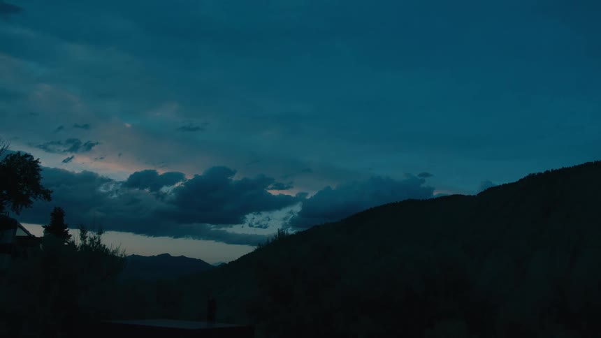 The sun is rising on the mountain