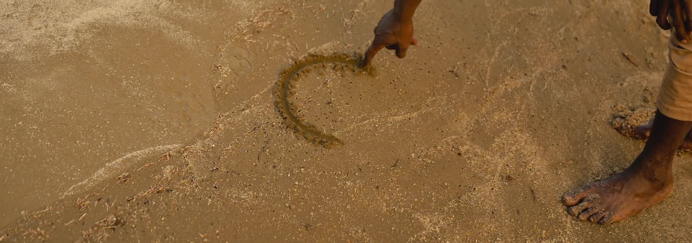 A man draws a circle in the and with his finger