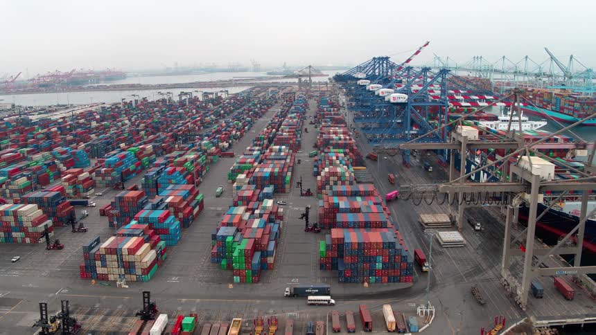 Aerial view of a busy  Los Angeles port with cargo containers and docked ships