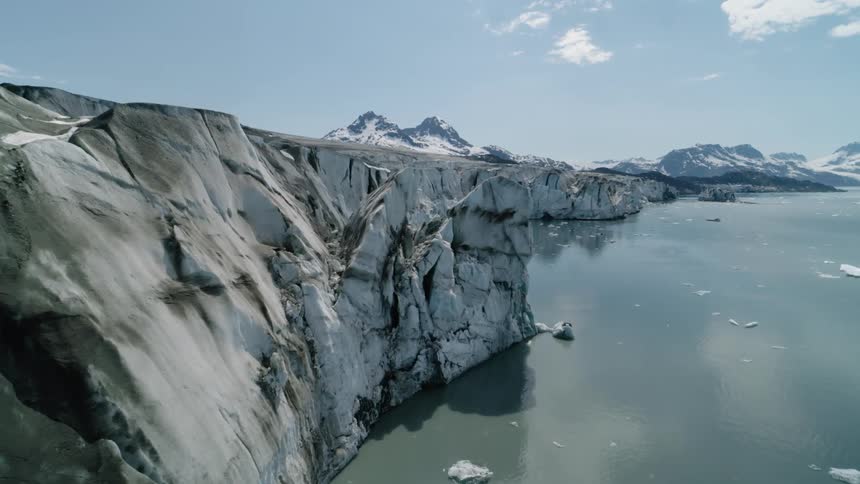 Drone view of Alaskan Arctic scenery with mountains on the horizon