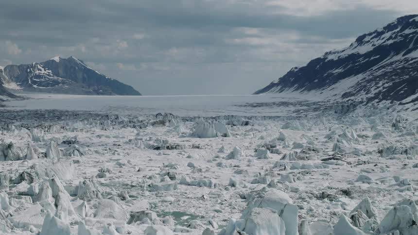 Ice and snow with mountains along the arctic coast