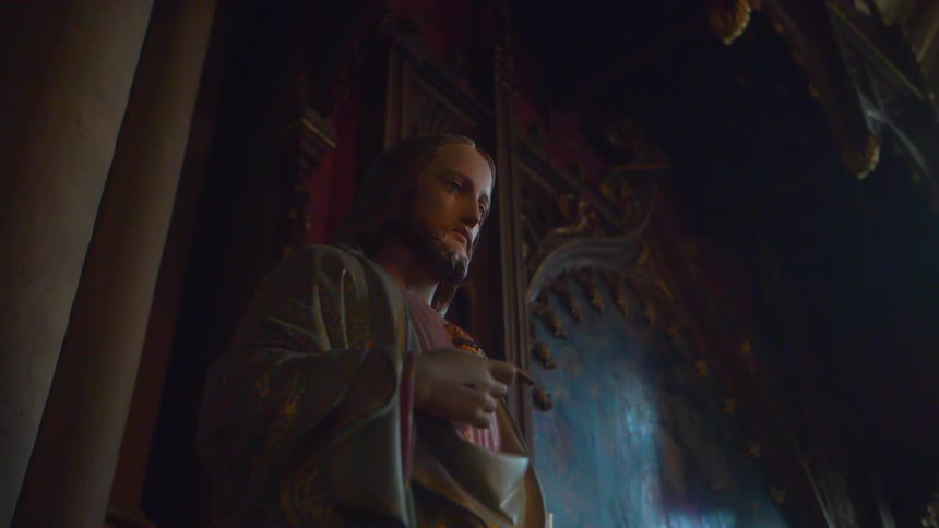 A statue of jesus stands in a church