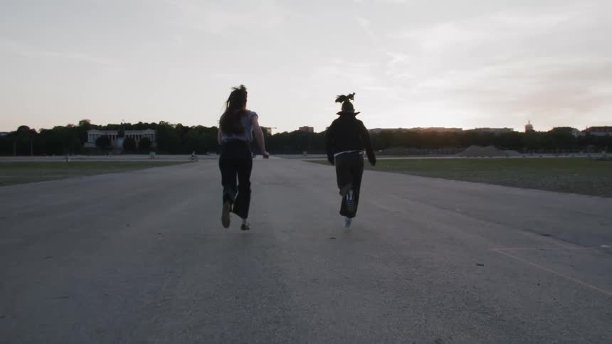 Two women running outdoors at dawn