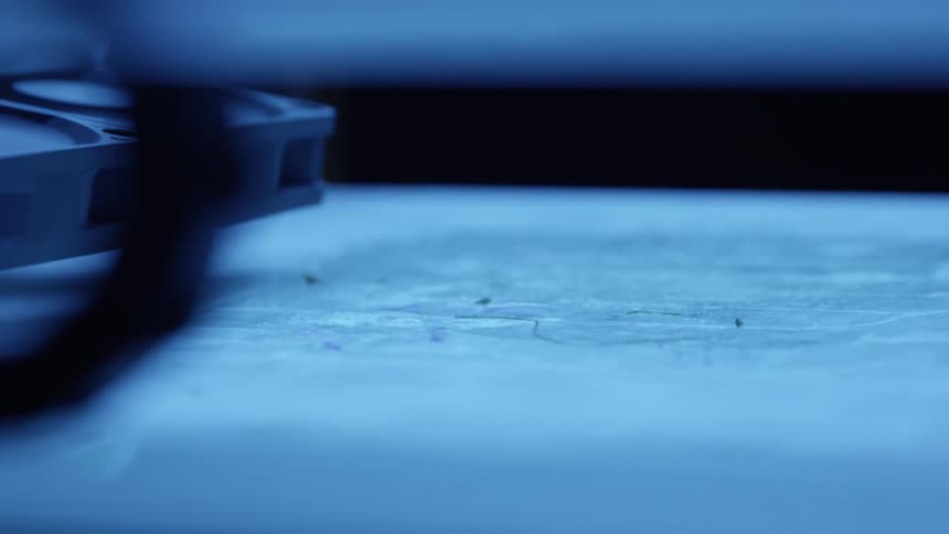 The machine is pressing down and moving