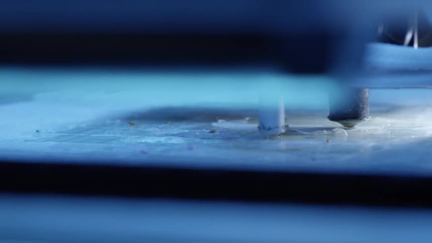 Close up of a 3d printer in motion while creating a 3d print