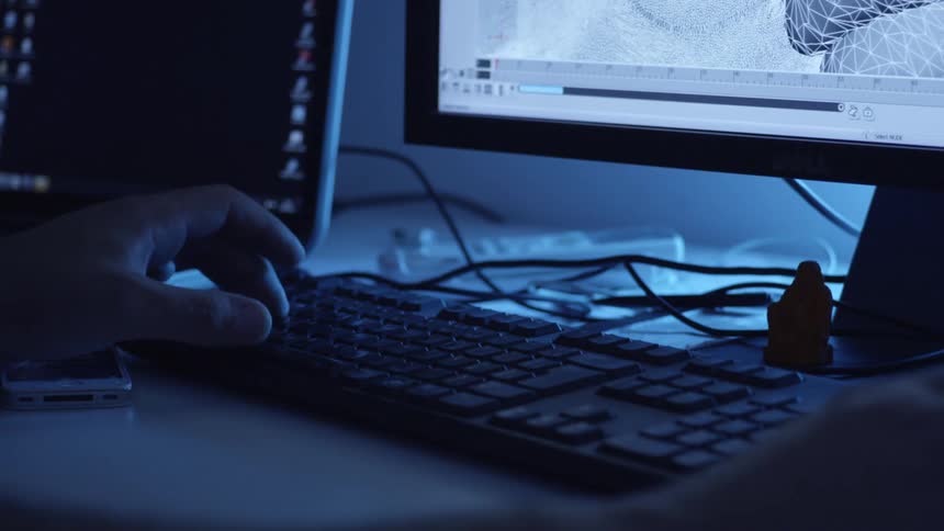 Pair of hands on a keyboard on the table