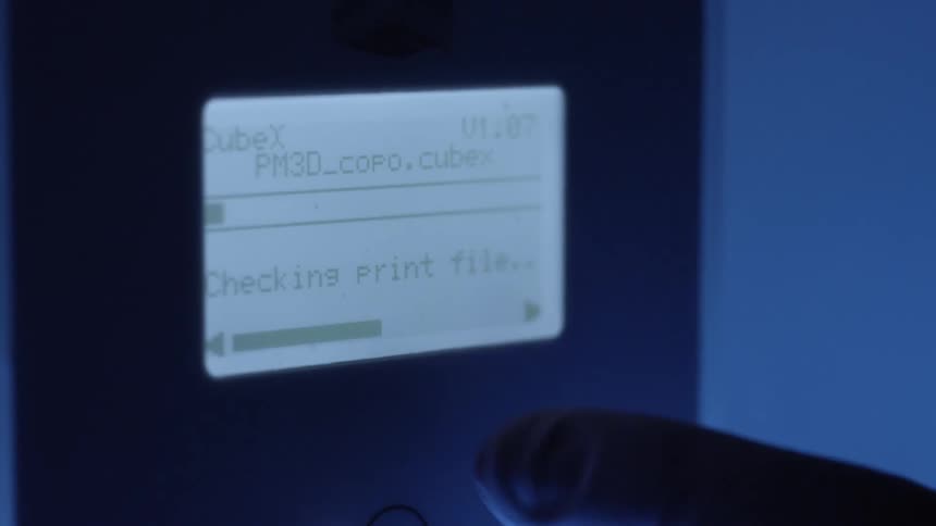 Gloved hand clicking on a screen of an electronic device