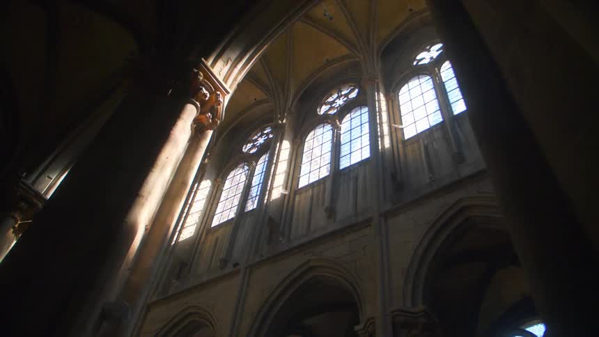 The church has tall pillars and windows above