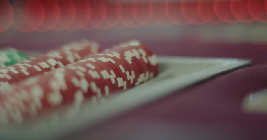 Red poker chip rows on a table