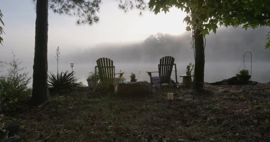 Near the water two chairs are set
