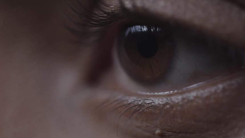Extreme close up of a womans blinking eye