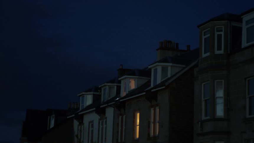 In a suburban city all the lights are off except one house