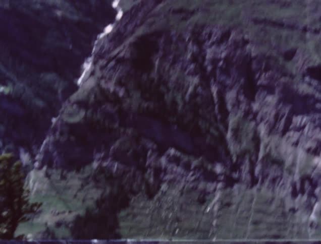 A town sits at the bottom of a hill