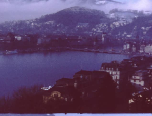 City buildings surround a lake