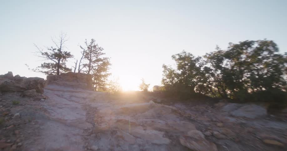 The sun is rising on the very tall mountain
