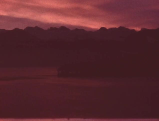A panorama of mountain peaks at dusk