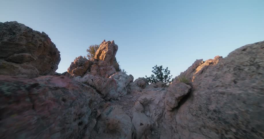 A rocky terrain valley going uphill