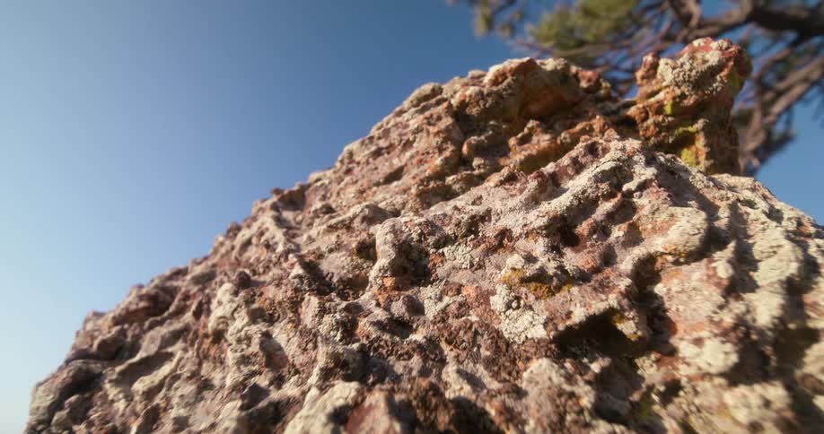 Weathered rock in a natural area against a clear blue sky