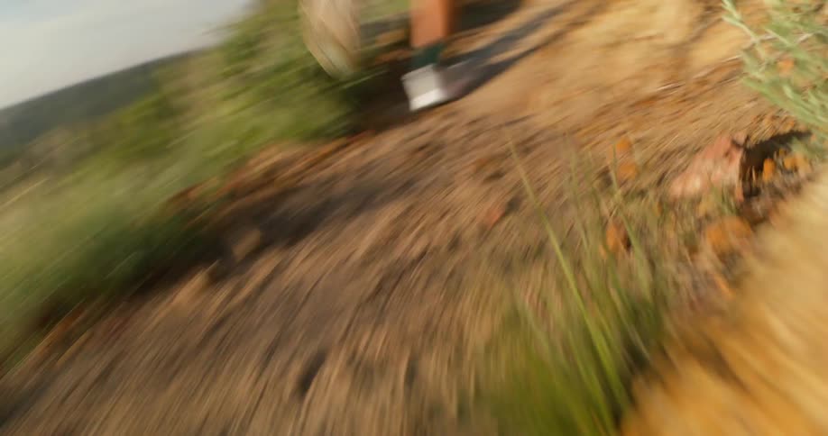 Woman running intensely down a trail
