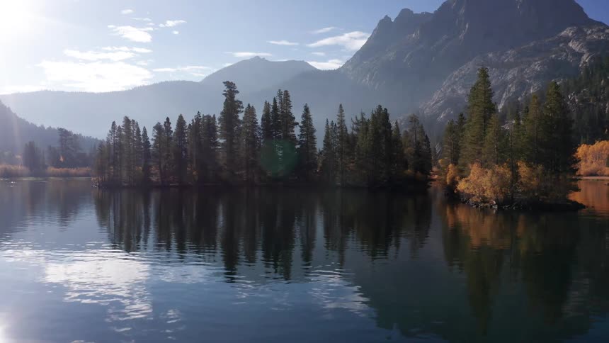 The sun reflects on the water of Silver Lake, California