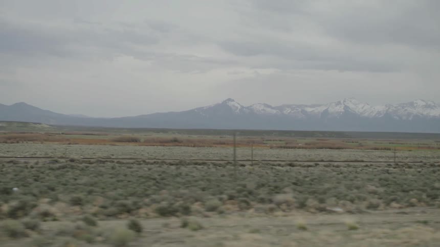 Desert expanse with mountains in the background