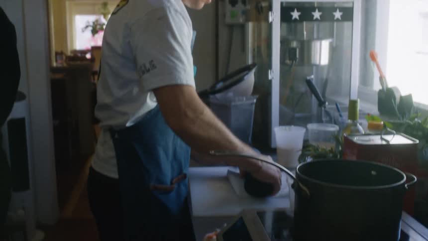 Chef holding a blue roll