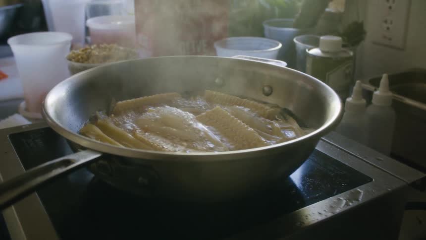 Close up of corn slices boiled in a cooking pan in the kitchen during daytime