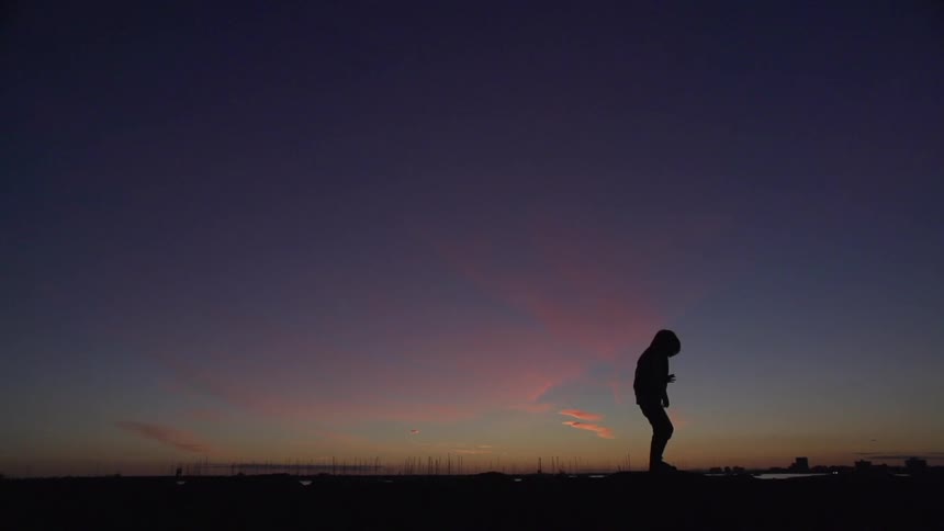 A person standing on the horizon