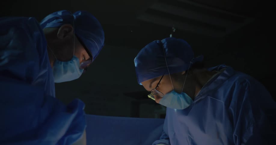 Surgeons in action in a hospital operating room