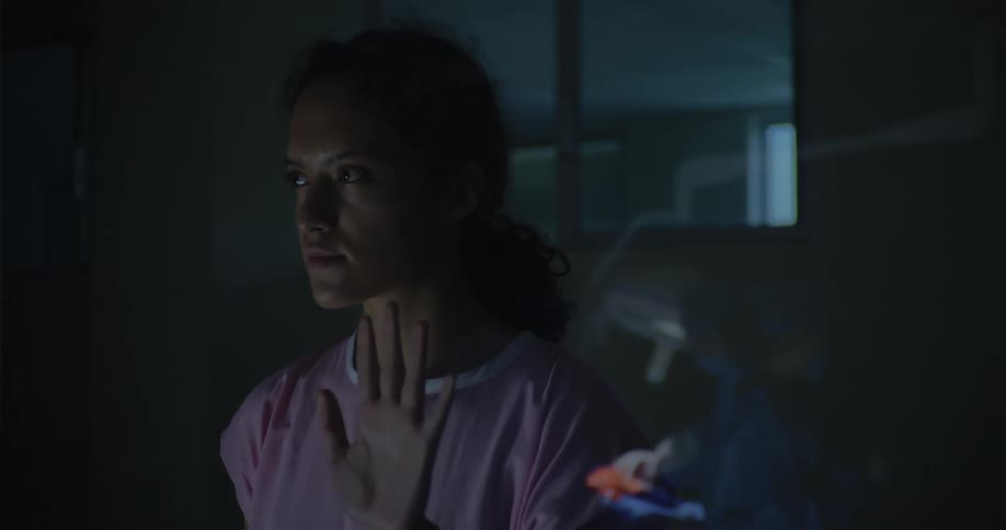 Woman watching surgery in a hospital