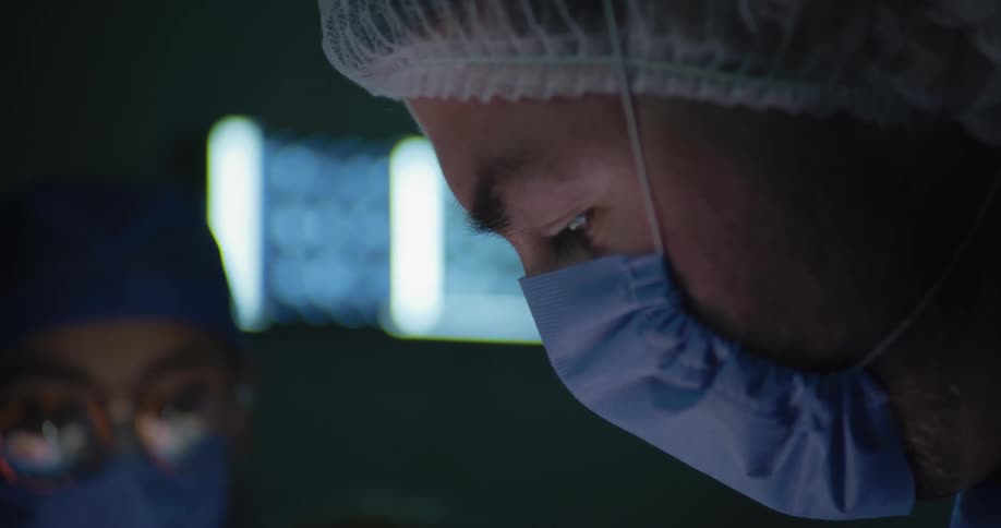 The doctors are working together in the operating room