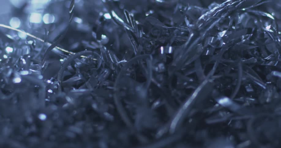 Metal shavings fall and pile up