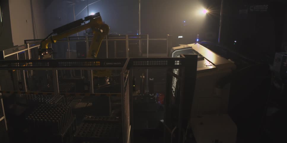 The robotic arm is working in the dark