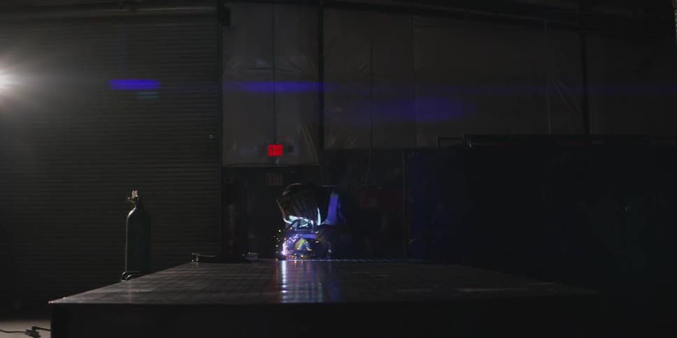 A man is welding with a torch