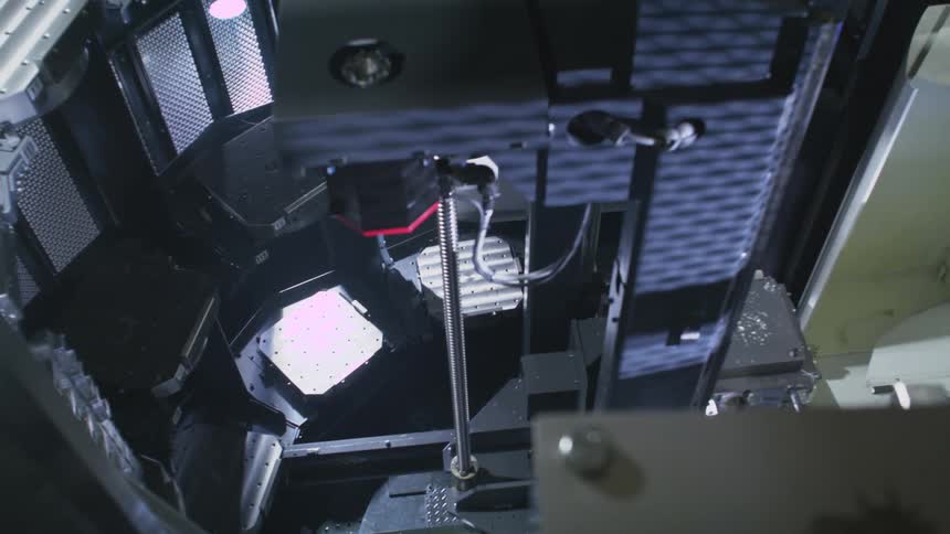 The machine is moving items around with a robotic platform