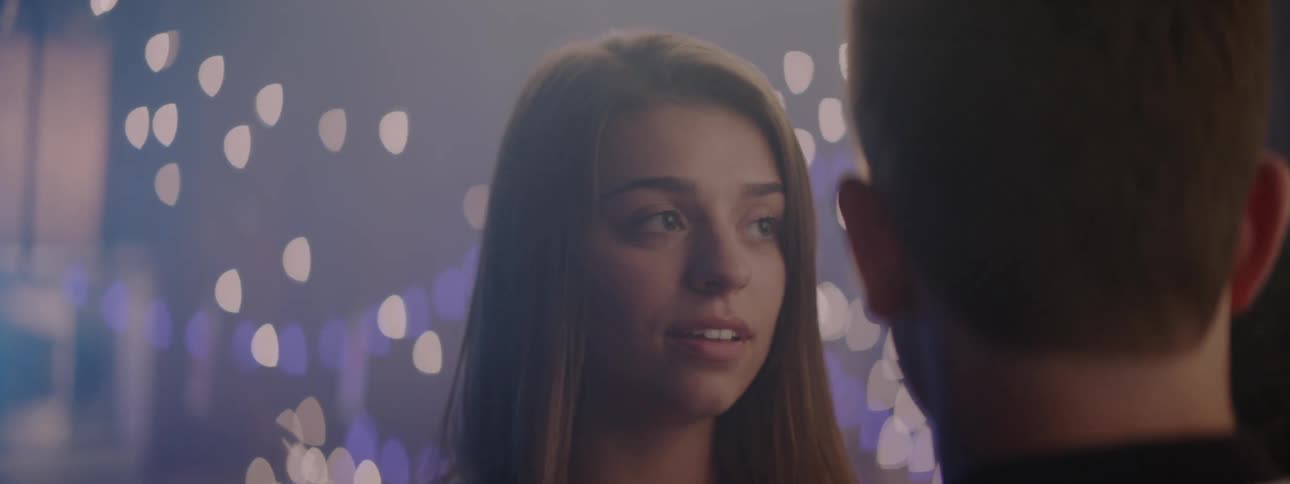 A boy kisses a girl