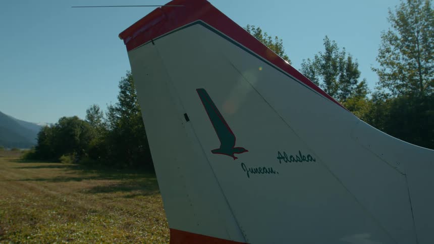 Wing of an airplane landing in a rural area