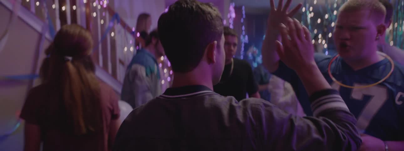 Young people dance and mingle at a party