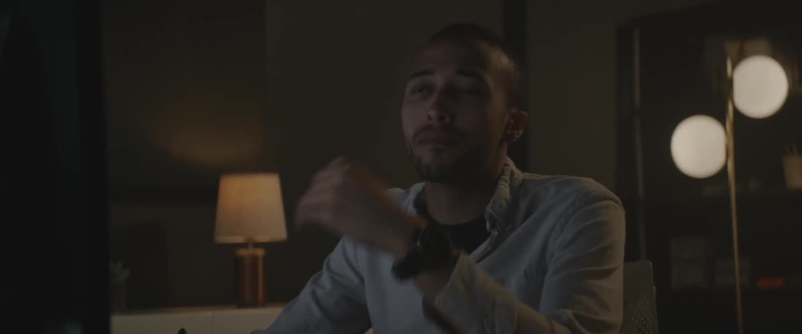 A man is drinking from a coffee mug