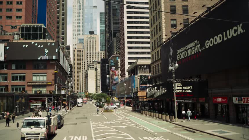 Urban street with pedestrians and vehicle traffic