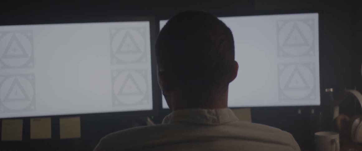 A man is working on a computer