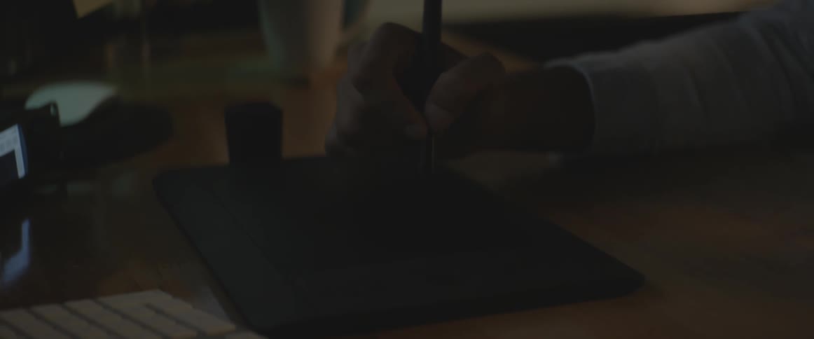 A man draws on a tablet